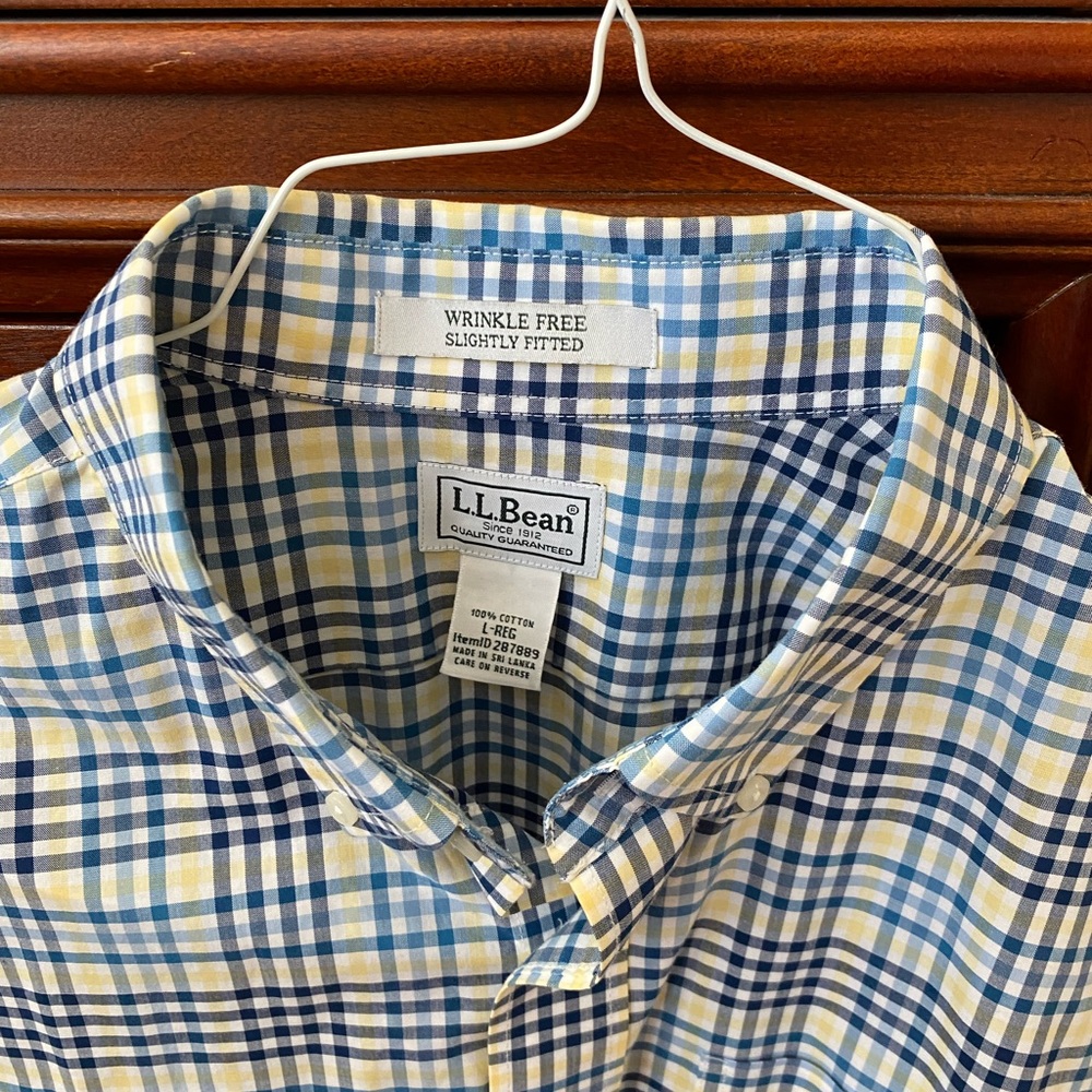 Crisp, pretty plaid in blues, white and yellow.  Button-down, long sleeve.